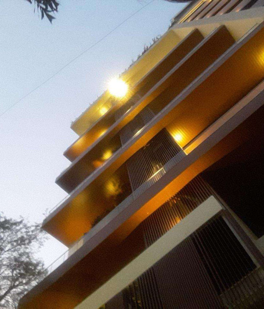 Illuminated facade of Merint 219 at dusk