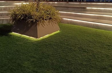 Lit amphitheatre seating with landscaped planter