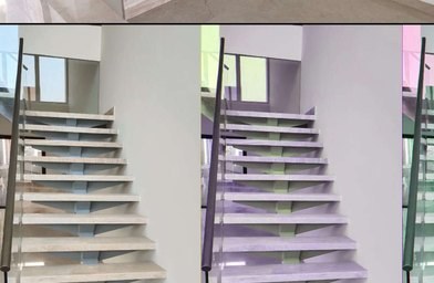 Cantilevered stone staircase with glass railing